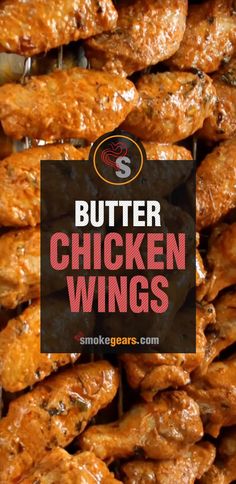 some chicken wings are piled on top of each other with the words butter chicken wings above them