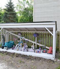 an outdoor storage shed with various items on the outside and in it's sides