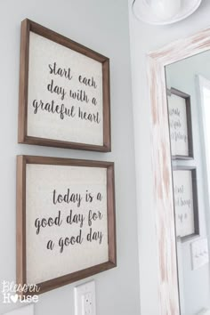 two framed pictures on the wall above a mirror