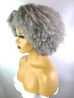 Our natural texture Afro Kinky Curly Wig with Afro Hairline will definitely have all eyes on you. This wig mimics human hair with it's low luster and soft texture. Everyone will believe it's your natural hairline with our realistic ear to ear afro hair. Numerous styling options are available. Made with premium heat resistant synthetic fiber on a machine made elastic cap. Fits small to medium size crowns. It's sure to become your go-to wig. Human Hair Afro Wigs, Silver Fox Hair, Grey Hair Extensions, Tapered Afro, Handmade Dreadlocks, Grey Curly Hair, Crochet Wig, Silver Foxes, Curly Bob Wigs