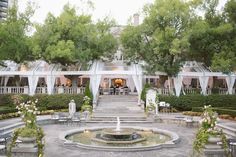 an outdoor wedding venue with tables and chairs