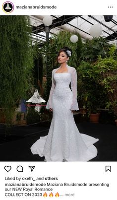 a woman in a white wedding dress standing next to a green house with plants on it