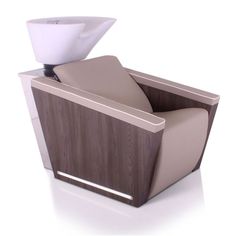 a chair with a white cup on top of it and an arm rest in the back