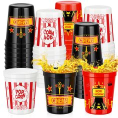 popcorn buckets filled with yellow and red confetti are shown in this image