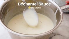 a ladle full of liquid being stirred in a pot with the words bechamel sauce on it