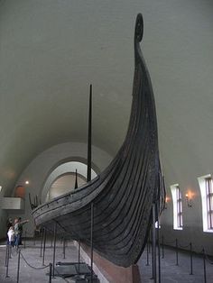 an old boat is on display in a museum