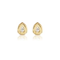 two diamond stud earrings in yellow gold