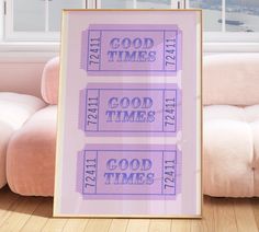 there is a poster on the floor in front of a window with words that say good times