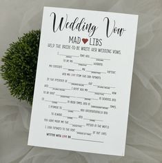 a wedding mad libs game is shown on top of a white sheet with greenery