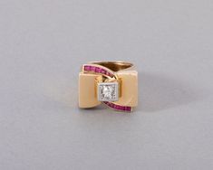 One very lovely vintage ring, made in France circa 1940. Made in yellow gold 18k and set with a central diamond of 0.20 carats approximately. The bred stones are maybe synthetic, it was common for that era. Dimension of front: 21 * 15 mm. Ring size 53 or 6.5 USA. Total weight: 14 grams. French Jewelry, Snake Bracelet, Multi Stone Ring, Vintage Ring, Multi Stone, Antique Rings, Stone Rings, Antique Gold, Vintage Rings