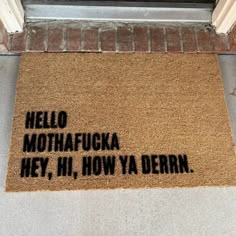 a door mat that says hello, mothhafuka hey, hi, how ya dern