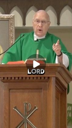 a priest giving a speech in front of a podium with the words lord on it