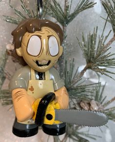 a christmas ornament with a man holding a saw