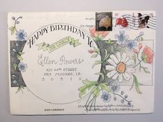 a birthday card with flowers on it