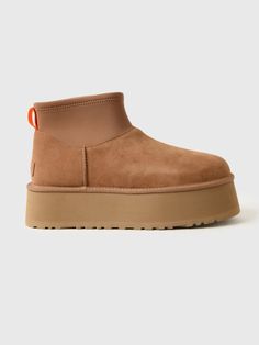 DESCRIPTION:A fashionable boot made from soft suede and finished with a soft UGGplush™ interior and a platform sole.FEATURES:Round ToeBack Pull TabSuede Upper17mm UGGplush™ Lining & InsoleFoam FootbedEVA Midsole & OutsolePlatform Height: 2 in. Ugg Ankle Boots, Mini Outfit, Ugg Classic Ultra Mini, Ugg Classic Mini, Baskets Nike, Nike Shox, Nike Air Max Plus, Ugg Classic, Platform Ankle Boots