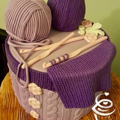 there is a cake made to look like yarn and knitting needles