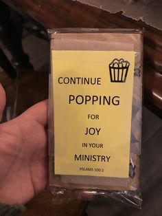 someone is holding up a package of candy that says, continue popping for joy in your ministery