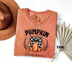 Comfort Colors® Pumpkin Season Shirts, Thanksgiving Shirts, Pumpkin Bow Shirt, Happy Thanksgiving, Cozy Pumpkin Sweater, Women's Fall Shirts PRODUCT SPECS: Comfort Colors Description 6.1 oz./yd² (US), 10 oz/L yd (CA), 100% ring-spun cotton, 30 singles Garment dyed for that lived in feel and almost no shrinkage at home. Soft ring-spun cotton fabric with 100% cotton threads Relaxed fit Topstitched, classic width, rib collar Shoulder to shoulder twill tape Signature twill label Unisex Crewneck Shir Fall Pumpkin Shirts, Cute Pumpkin Shirt, Pumpkin Shirts Women, Pumpkin Sweater, Thanksgiving Cotton Graphic Print T-shirt, Pumkin Spice Shirts, Cute Fall Shirt, Festival Shirt, Fall Shirts Women