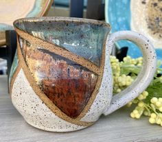 a close up of a coffee cup on a table