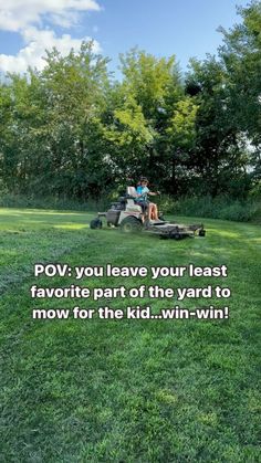 two people sitting on a lawn mower in the grass