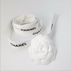 Chanel Ribbon, And The Famous Camelia Annie Chanel Box Topping Chanel Vintage Accessories, Camelia Chanel, Chanel Ribbon, Chanel Camellia Jewelry, Chanel Camellia Flower, Chanel Wallet On Chain Camellia, Chanel Aesthetic, Chanel Black And White, Chanel Box