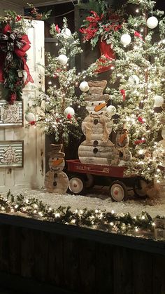 a christmas display with snowmen and trees