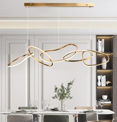 an elegant dining room with modern lighting fixtures