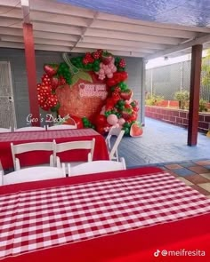 a table with red and white checkered cloth on it