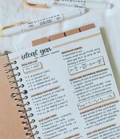 an open notebook sitting on top of a table