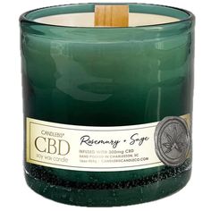 16 oz Rosemary Sage candle infused with 300mg of pure CBD in hand blown glass vessel and wooden wick.  Cooling eucalyptus and pine notes uplift fresh green florals and rosemary, while earthy sage and cedar lend this fragrance oil an enticing woodsy... Sage Candle, Wooden Wick, Botanical Beauty, Hand Candle, Glass Vessel, Natural Essential Oils, Rosemary, Soy Wax Candles, Fragrance Oil