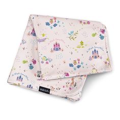 two baby swaddles on top of each other with princess castle and stars in the background