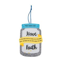 a glass ornament that says, have faith