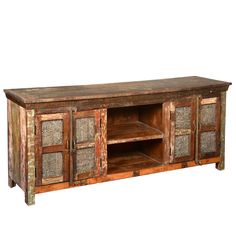 an old wooden entertainment center with glass doors