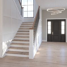 an empty entryway with stairs leading up to the door