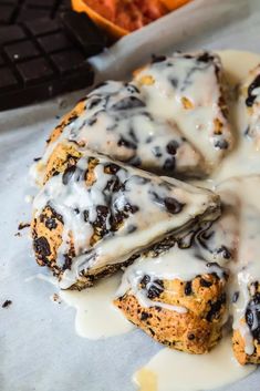 some type of pastry with icing and chocolate chips