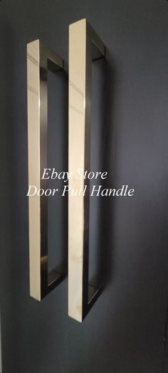 the door handle is made out of stainless steel and has two square shaped handles on each side