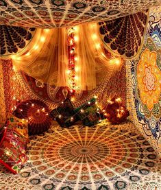 an elaborately decorated bed with lights and curtains