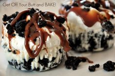 two cupcakes covered in ice cream and oreo cookies with chocolate drizzle