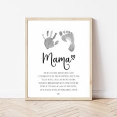 a baby's hand and foot print with the words mama on it