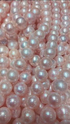 some white pearls are laying on top of each other