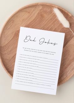 a wooden plate with a paper on top of it that says, dad stories written in cursive writing