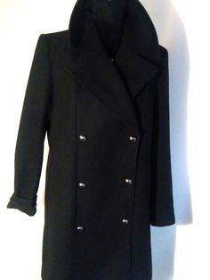 Wool and viscose coat. In good condition. Fits loosely. The length of the coat can be adjusted to fit you by sewing on the buttons. The length of the coat is above the knee. According to European sizes 38, US 6, UK 10, S-M-L M size. In good condition. Shoulder width 41cm/16.4" Arm length 60cm/24" Back length 82cm/32" Chest width at the front 50cm/20" Please compare these sizes with clothing that fits you well. If you have questions or need an additional photo, write. I will be happy to answer. T Black Wool Coat With Double-breasted Buttons, Black Pea Coat With Buttons For Winter, Black Winter Pea Coat With Buttons, Black Wool Coat With Buttons And Lapel Collar, Black Long Pea Coat With Double-breasted Button Fastening, Black Double-breasted Pea Coat With Lapel Collar, Black Long Double-breasted Pea Coat, Winter Outerwear With Covered Buttons And Lapel Collar, Black Wool Coat With Button Closure For Fall