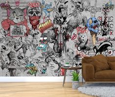 a living room with a couch and wall covered in graffiti