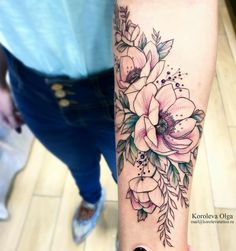 a woman's arm with flowers on it and the words instagramn above her