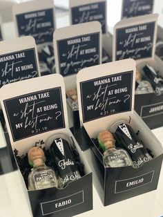 there are many small bottles with writing on them in the same box as each other