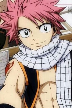 an anime character with pink hair wearing a scarf and scarf around his neck, standing in front of a brick wall