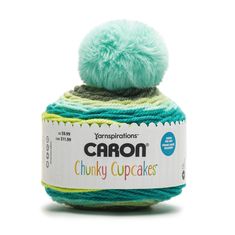 the yarn ball is green and blue with a pom - pom on top