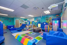 an indoor play area with slides and toys