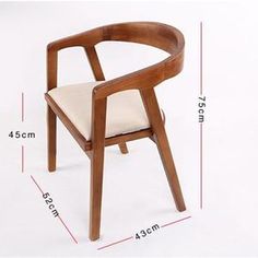 a wooden chair sitting on top of a white floor next to a measuring line with measurements for the seat and back