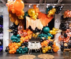 a room filled with balloons and decorations